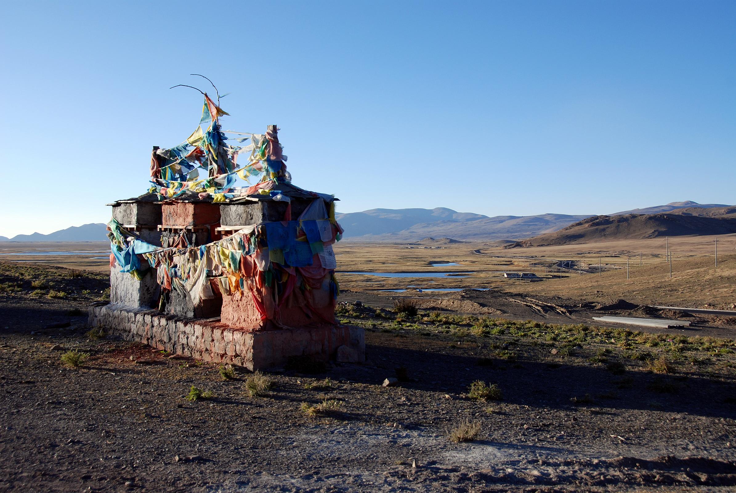 30 Chortens With View To West From Hill Above Old Zhongba Tibet At Sunset Chortens dot the hills above Old Zhongba in Tibet, here with a view towards the west at sunset.